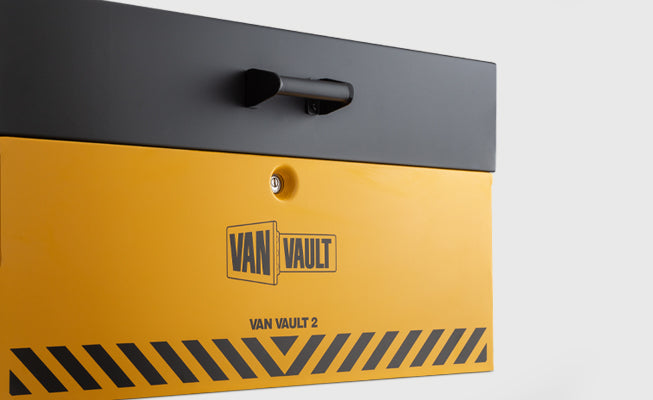 Yellow storage box with black handle and Van Vault branding on a light gray background
