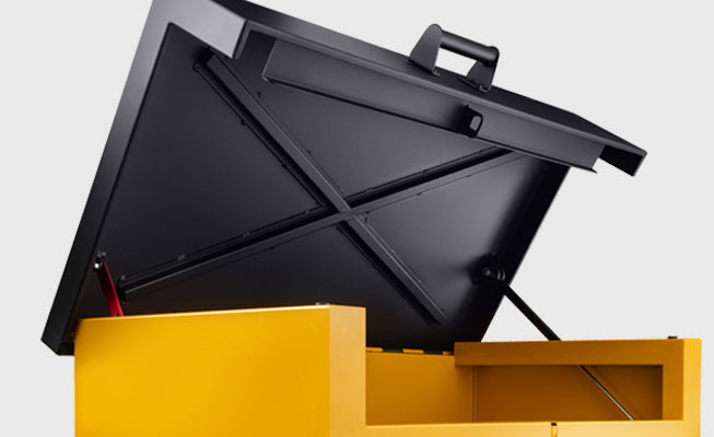 Black dumpster with yellow base on a light gray background