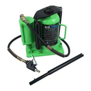 Green air compressor with hose and nozzle on a white background