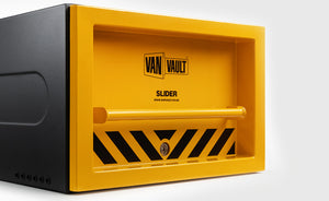 Yellow and black Van Vault safe on a white background