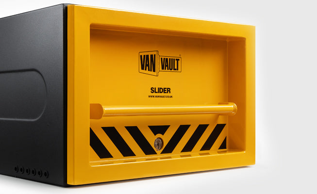 Yellow and black Van Vault safe on a white background