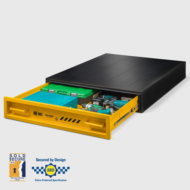 Black safe with yellow drawer open, displaying green and blue items on a white background.