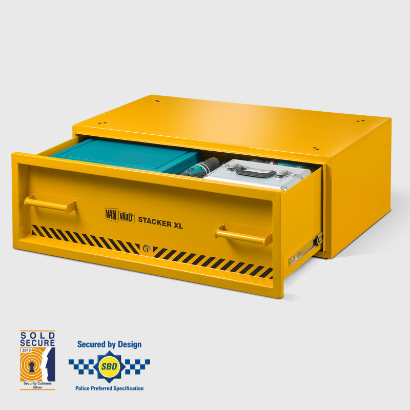 Yellow safe box with open lid on a white background, featuring certification logos.