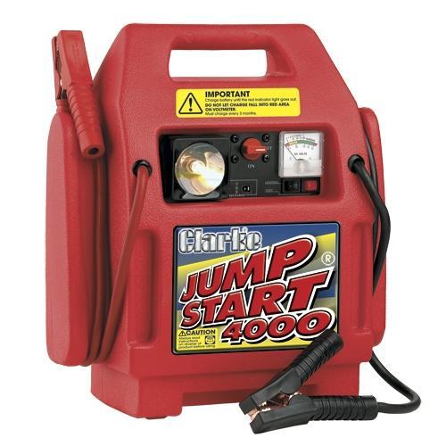 A red Clarke Heavy Duty Jumpstart 4000 unit with a battery and cables, designed for vehicle jump starting.